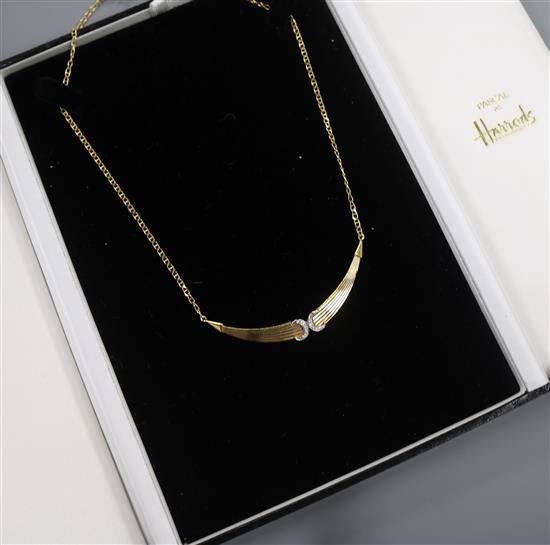 An 18ct three-colour gold pendant necklace incorporating two diamond-set crescents,